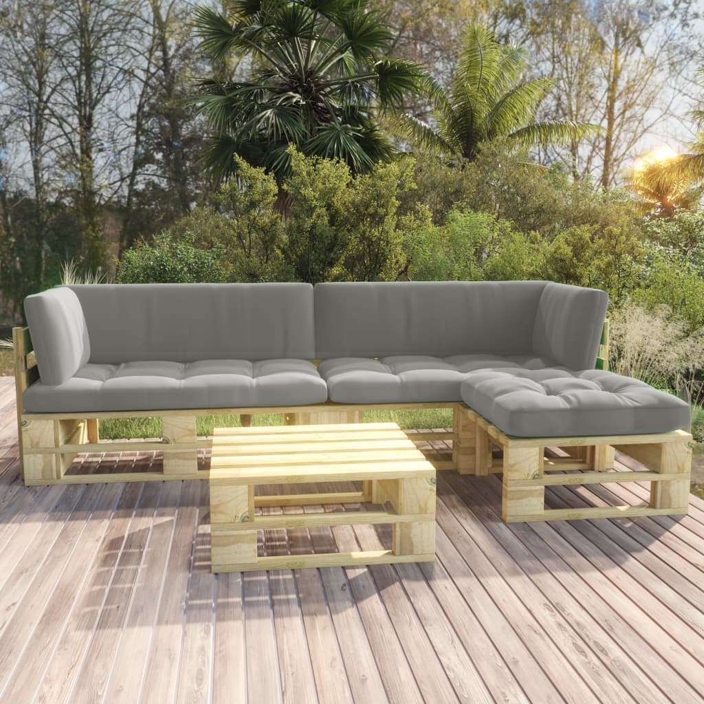 Four-piece pine pallet lounge set with gray cushions on a garden deck